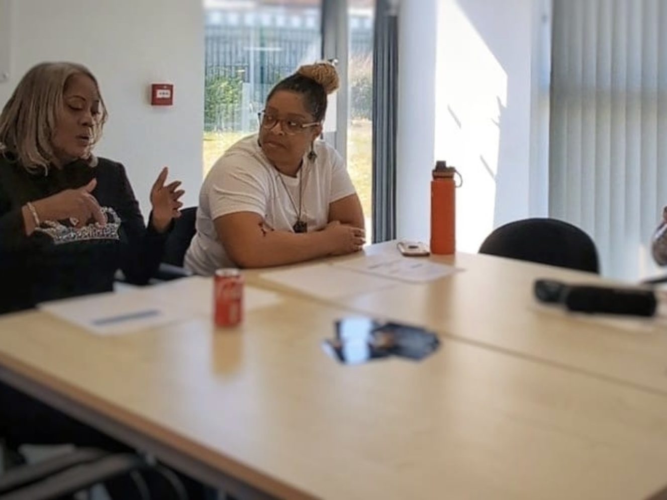 "Two women talking about menopause experience as part of a wider wellness  support."